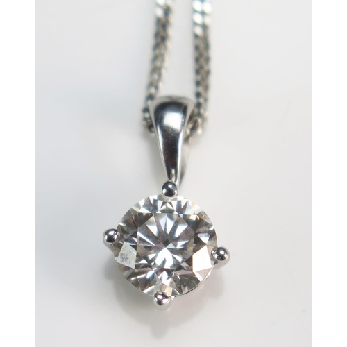 152 - An 18ct White Gold and Diamond Pendant, 5.6mm brilliant round cut and on an 18ct 18