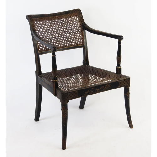 1524 - A 19th century Chinoiserie decorated elbow chair, with cane panel seat and back, raised on swept fro... 