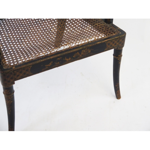 1524 - A 19th century Chinoiserie decorated elbow chair, with cane panel seat and back, raised on swept fro... 