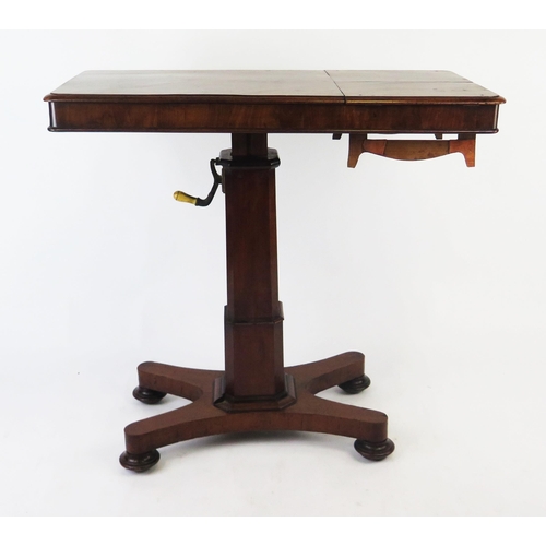 1527 - A Victorian reading table, the rising rectangular top with hinged ends, on a polygonal column and qu... 