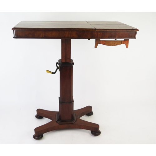 1527 - A Victorian reading table, the rising rectangular top with hinged ends, on a polygonal column and qu... 