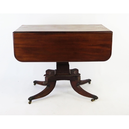 1528 - A 19th century mahogany pedestal Pembroke table, the rectangular  top with hinged leaves and an end ... 