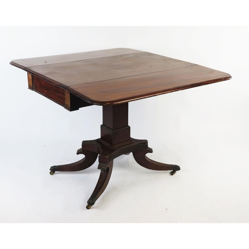 1528 - A 19th century mahogany pedestal Pembroke table, the rectangular  top with hinged leaves and an end ... 