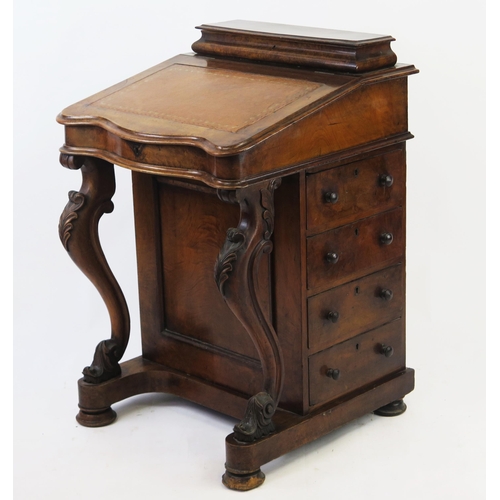 1532 - A Victorian walnut davenport, with hinged stationery well, sloping hinged writing surface with four ... 