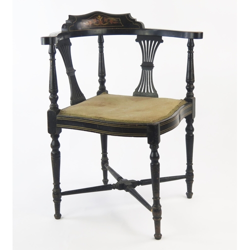 1534 - A late Victorian ebonised and inlaid corner chair, of serpentine outline with padded seat, on turned... 