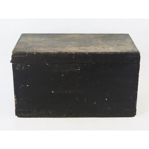 1540 - A large 19th century black painted wood trunk, the rectangular hinged lid enclosing two lift-out tra... 