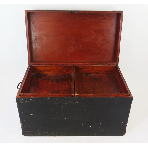 1540 - A large 19th century black painted wood trunk, the rectangular hinged lid enclosing two lift-out tra... 