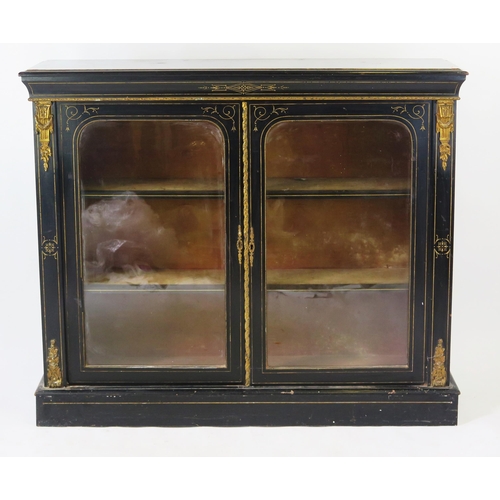 1542 - A Victorian ebonised and gilt metal mounted  pier cabinet, with a rectangular top with moulded edge,... 