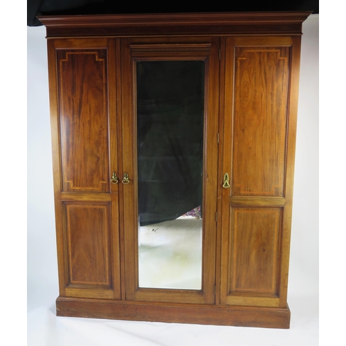 1543 - An Edwardian Mahogany and Strung Triple Wardrobe with a central mirror, 172(w)x56(d)x208(h)cm