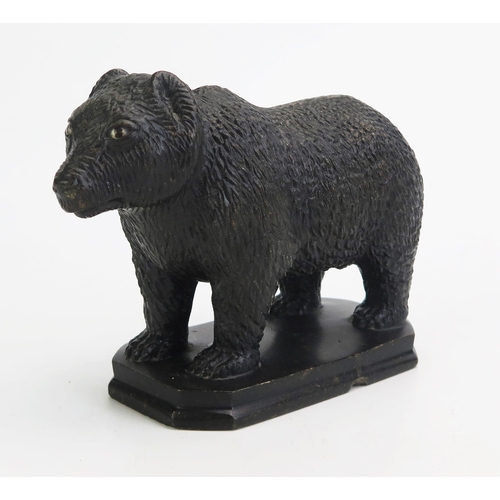 1548 - A carved hardstone model of a bear, in the Black Forest style, with inset glass eyes, on a rectangul... 