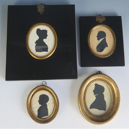 1553 - A collection of four assorted silhouettes, contained in ebonised or gilded frames, (4)