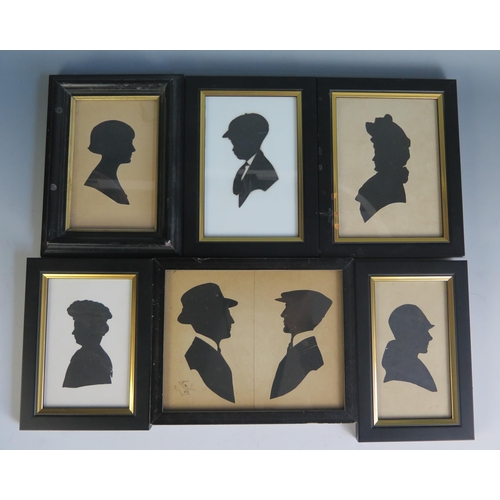 1555 - five assorted 20th century silhouettes, contained in ebonised frames, various sizes.