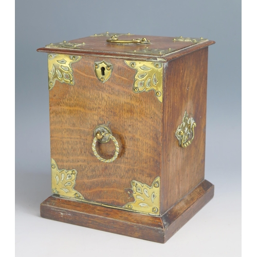 1558 - A late Victorian oak and brass bound tea caddy in the form of a coal purdonium, with hinged fall fro... 