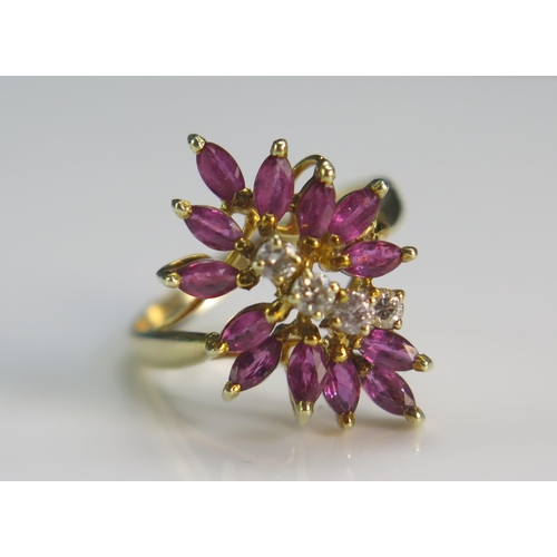 156 - A 14K Gold, Ruby and Diamond Cluster Ring, 21x14.6mm head, sizeL.5, stamped 585 14K, 3.66g