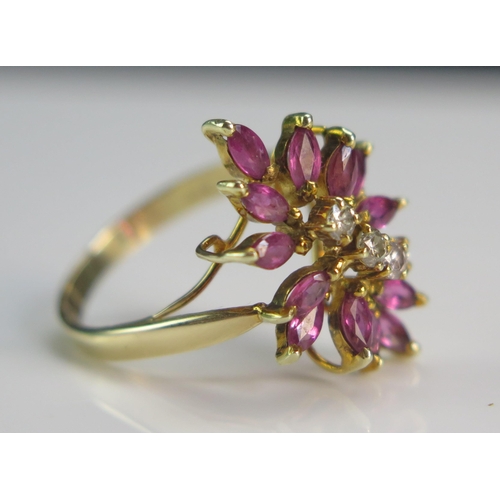 156 - A 14K Gold, Ruby and Diamond Cluster Ring, 21x14.6mm head, sizeL.5, stamped 585 14K, 3.66g