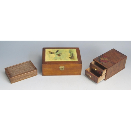 1560 - A treen rectangular box with sliding top, 9cm long, together with two other treen boxes. (3).