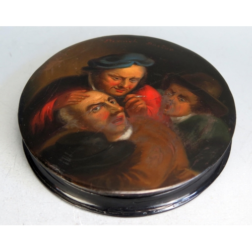 1562 - A 19th century Stobwasser style circular lacquered snuff box, the lid decorated with the 'Flemish Do... 