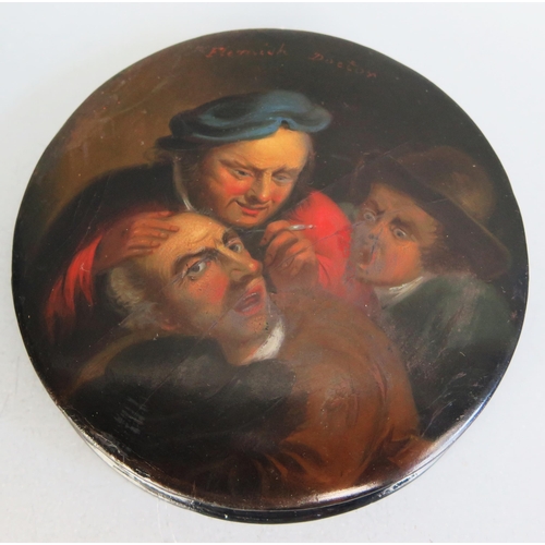 1562 - A 19th century Stobwasser style circular lacquered snuff box, the lid decorated with the 'Flemish Do... 