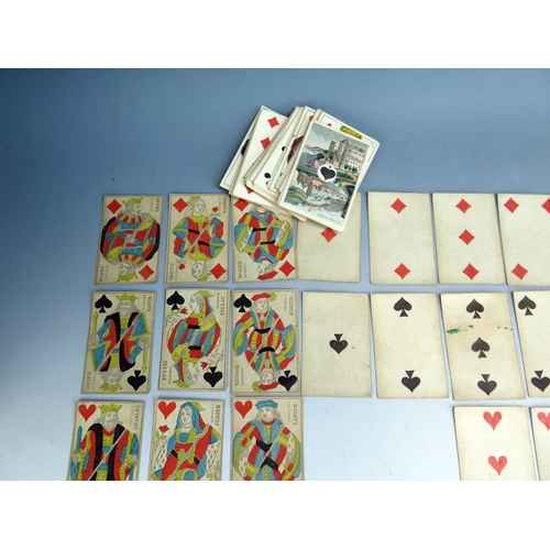 1564 - A 19th century German castle  part set of playing cards, 50/52, together with two other 19th century... 