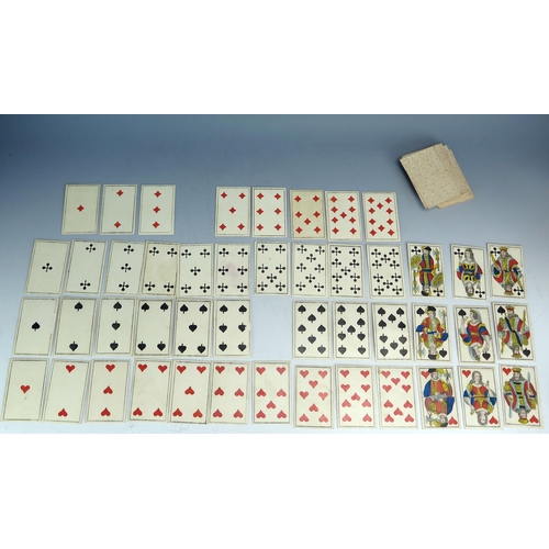 1564 - A 19th century German castle  part set of playing cards, 50/52, together with two other 19th century... 