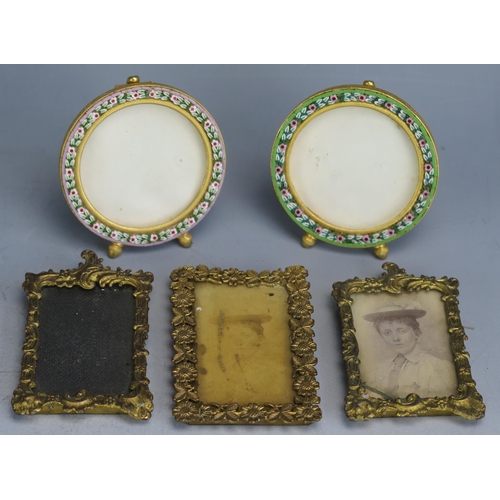 1565 - A collection of miniature gilt metal photograph frames including micromosaic examples.