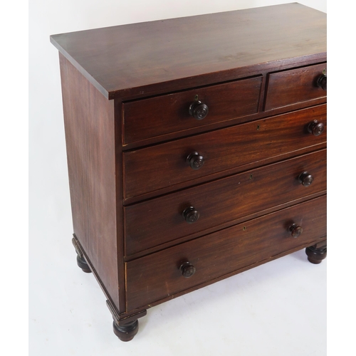 1572 - A 19th century mahogany chest containing two short and three long graduated drawers, on bun feet, 10... 