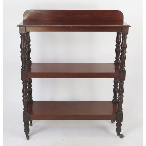 1575 - A 19th century mahogany three tier dumb waiter, of rectangular outline, raised on ring turned suppor... 