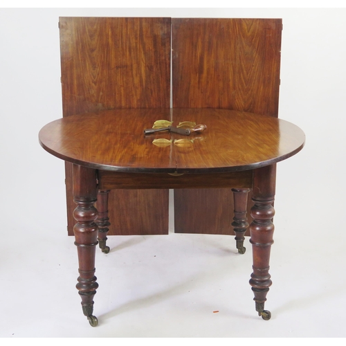 1576 - 19th century mahogany extending circular dining table, raised on ring turned and tapering legs termi... 