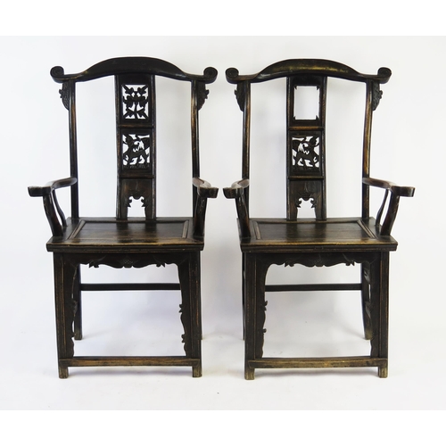 1581 - A pair of Chinese stained hardwood elbow chairs with swept top rail, pierced carved panel slatted ba... 