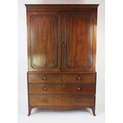 1583 - A 19th mahogany linen press, the upper part with a moulded cornice and two moulded panel doors enclo... 