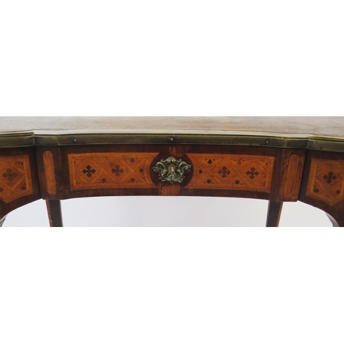 1586 - A French kingwood, rosewood an inlaid writing table of kidney-shaped outline, with tooled leather wr... 