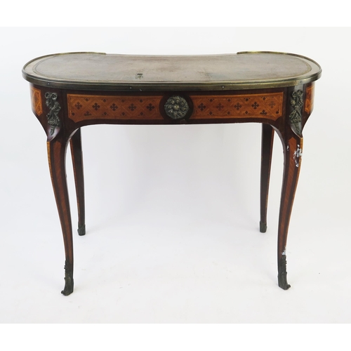 1586 - A French kingwood, rosewood an inlaid writing table of kidney-shaped outline, with tooled leather wr... 