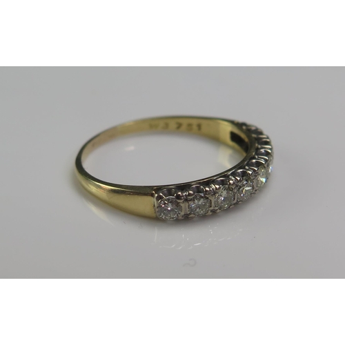 159 - An 18ct Gold and Diamond Nine Stone Half Eternity Ring, 2.7mm brilliant round cuts, size R.5, stampe... 