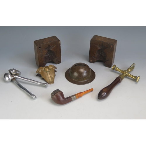 1604 - A 19th century brass pastry jig  with turned mahogany handle, treen butter mould, nut cracker in the... 