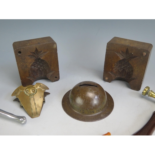 1604 - A 19th century brass pastry jig  with turned mahogany handle, treen butter mould, nut cracker in the... 