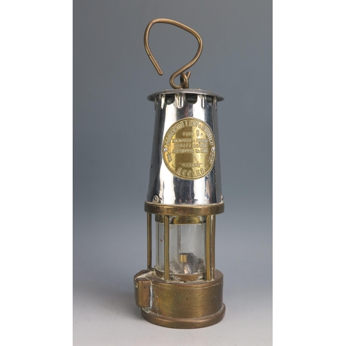 1609 - A brass and metal miners lamp of traditional design, 25cm high.