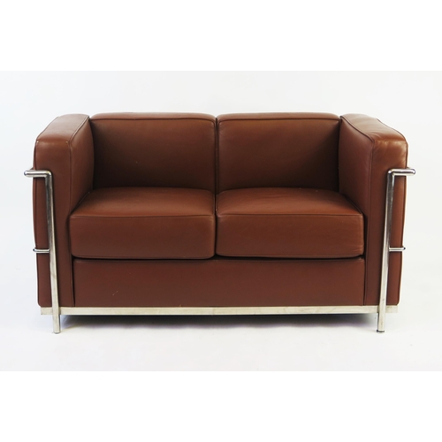 1630 - A Le CorbusierLC2 style two-seater settee with tan leatherette upholstery with chromed tubular frame... 