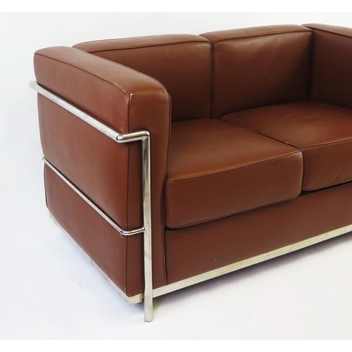 1630 - A Le CorbusierLC2 style two-seater settee with tan leatherette upholstery with chromed tubular frame... 