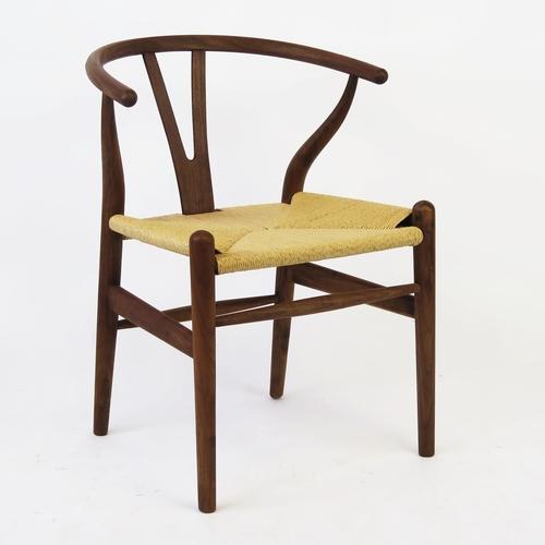 1635 - A Carl Hansen style wishbone chair, with shaped back and armrests, woven cord seat on turned legs.