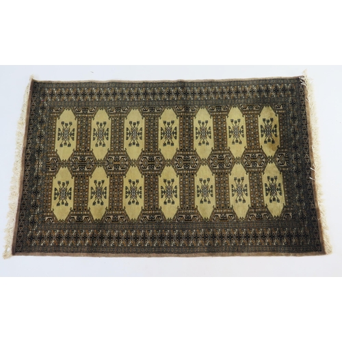 1695 - A Hamadan zaronim rug, the olive green field with two rows of hooked lozenge medallions, enclosed by... 