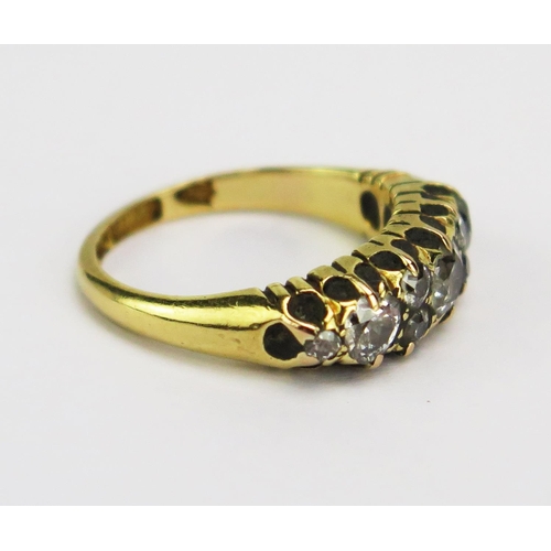 17 - A Victorian 18ct Gold and Diamond Ring, c. 3.5mm principal old cut stone, flanked by c. 3mm stones a... 