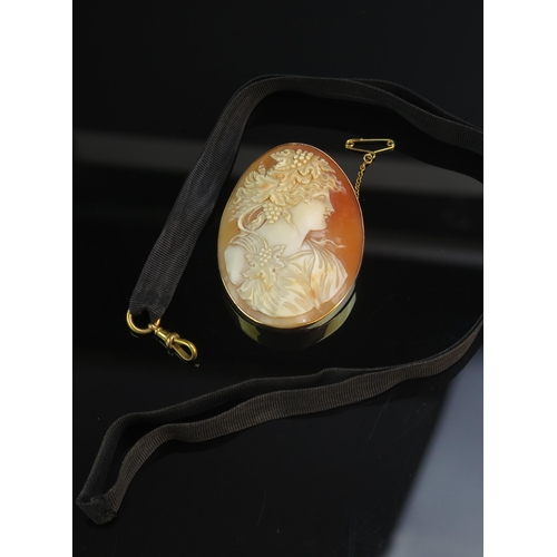 179 - A large 19th Century 15ct Gold Shell Cameo Brooch with hinged pendant mount and black strap with 9ct... 