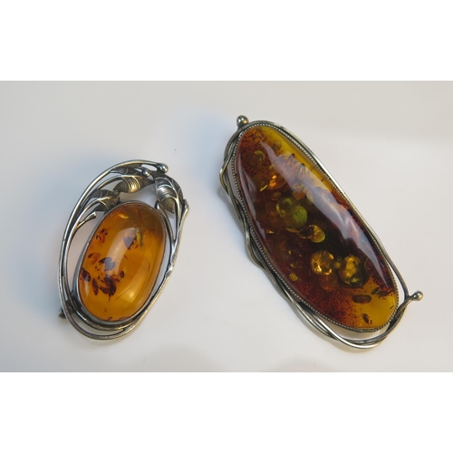 188 - A Silver and Amber Brooch with leaf decoration (47.8x28.8mm) and one other