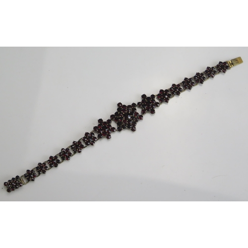 263 - A Garnet Bracelet in a gilt metal setting, 17.8g