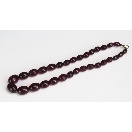 284 - A Faux Cherry Amber Necklace, largest c.17.7x12.9mm, 30g