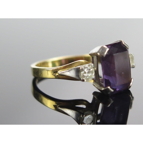 291 - An 18ct Gold, Amethyst and Diamond Three Stone Ring, 10.4x8.3mm principal stone with brilliant round... 