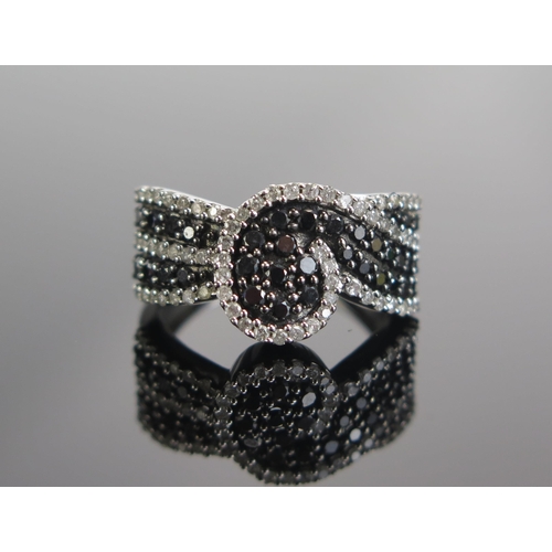 297 - A 9ct White Gold, Black and White Diamond Dress Ring, size M.5, hallmarked, 4.58g