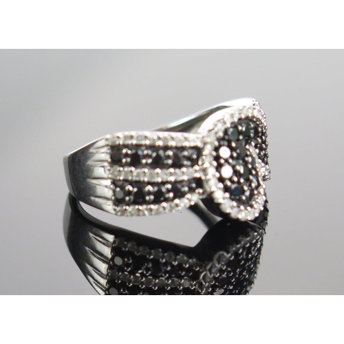 297 - A 9ct White Gold, Black and White Diamond Dress Ring, size M.5, hallmarked, 4.58g