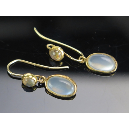 302 - A Pair of Moonstone Drop Earrings in a precious yellow metal setting, 29.5mm drop, 2.65g