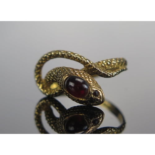 305 - A 9ct Gold and Garnet Snake Ring, size N.5, hallmarked, 3.15g